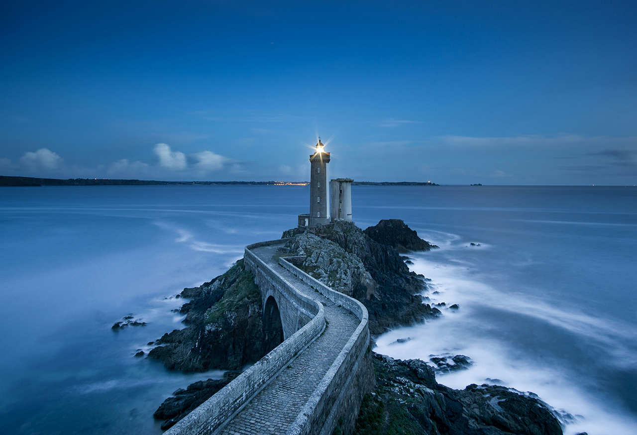 Lighthouse on a rocky outreach